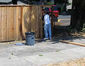 Putting up new fence boards