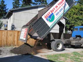 Topsoil being unloaded on the driveway