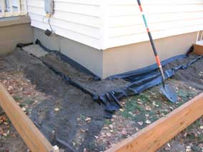 Starting to fill against the foundation wall with mason's sand and pea gravel