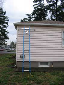 Extension ladder to clean out the gutters