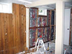 Paneling removed from half of west wall