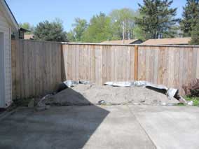 Sand pile moved to back fence