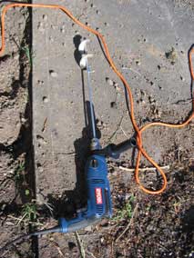 Mini-auger to help break up the ground