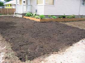 Front yard with topsoil laid out and graded