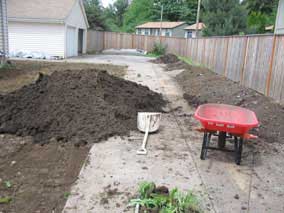 Topsoil pile after covering the front yard