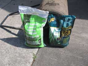 Bags of fertilizer and grass seed