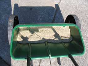 Grass seed in drop spreader