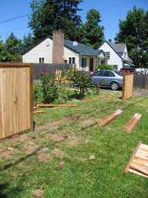 Front fence with misaligned posts removed and a couple panels complete