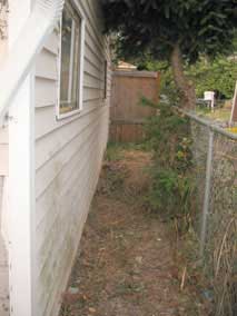 Looking east along south wall of garage