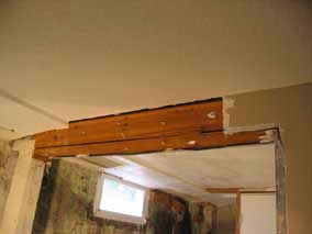 Some drywall removed from center beam and post