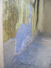 Scraping wallpaper and texture off the concrete walls