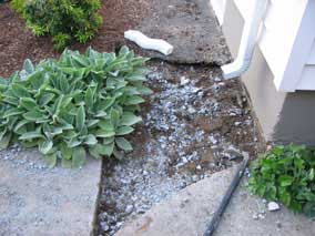 Breaking up sidewalk behind house to dig electrical trench