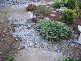 Breaking up sidewalk behind house to dig electrical trench