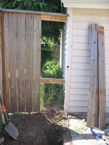 Fence boards removed to continue electrical trench