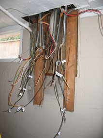 Electrical wiring disconnected and labeled, old electrical panel removed