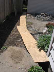 Electrical trench covered with plywood