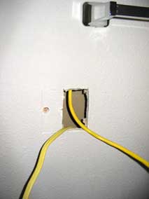 Hole cut for new electrical box in bathroom and wires pulled