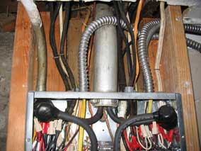 New conduit routed down into electrical panel