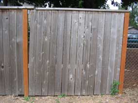 Loose section of fence along driveway