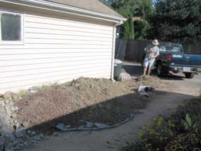 Dirt pile by the garage