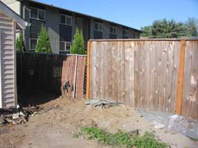 Area next to garage where I plan to add another section of fence