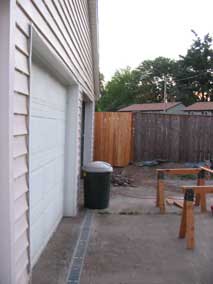 New fence section next to garage