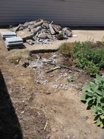 Breaking up sidewalk behind house