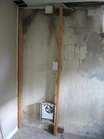 Electric wall heater in back room of basement to be removed