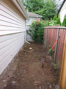 Debris and extra soil cleared out by garage