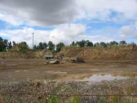 Ridge of dumped soil and rock