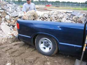 Truck loaded down with broken concrete