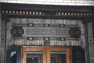 Art glass transom and motto on building in Printers Row