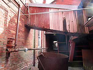 Looking back at passage by the crown gears at historic Thomas Kay Woolen Mill, Salem, Oregon