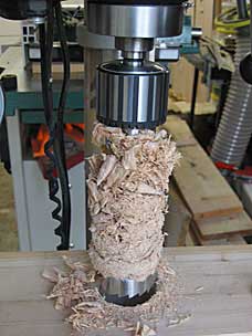 Lots of wood chips from drilling a deep hole