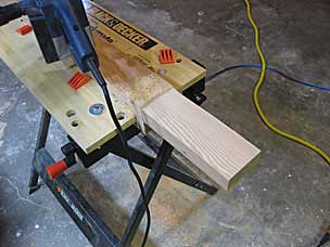 Reducing thickness of tenon with belt sander