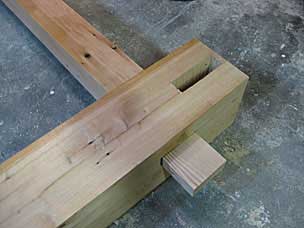 Through tenon on long stretcher in mortise