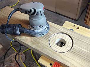 Smoothing bottom of vise garter mortise with random orbit sander