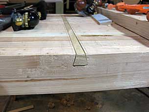 Sliding dovetail on underside of workbench top