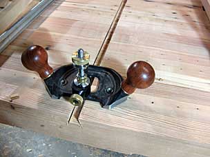 Clearing sliding dovetail slot with router plane