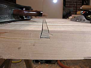 Sliding dovetail on underside of workbench top