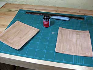 Contact cement applied to leather pads for vise chops