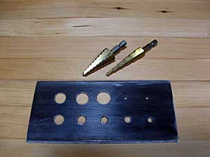 Second dowel plate made with stepped drill bits