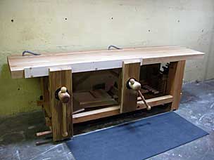 Workbench with appliances and clamps stored below