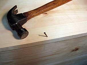 Hammering cut nail at an angle