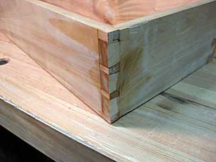 Bottom tool chest tray dovetailed corner with wedges