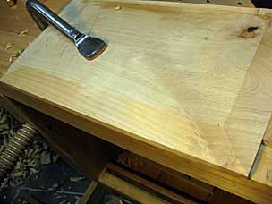 Long-grain bevel meeting cross-grain bevels on underside of nightstand top