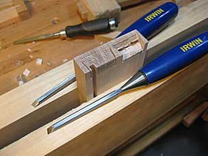 Chopping waste in half blind dovetail, two skew chisels