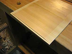 Rabbet along front edge of drawer bottom, with bevels on sides