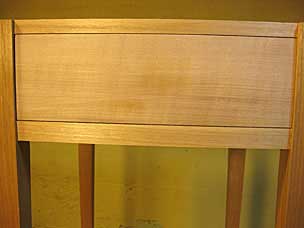 Drawer fitted into opening in nightstand