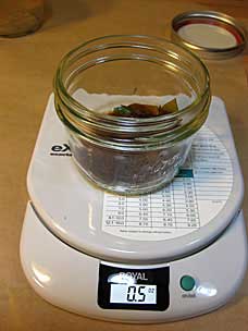 Shellac flakes in mason jar on scale